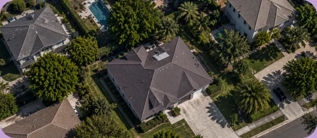 Aerial view of a house and its surrounding property