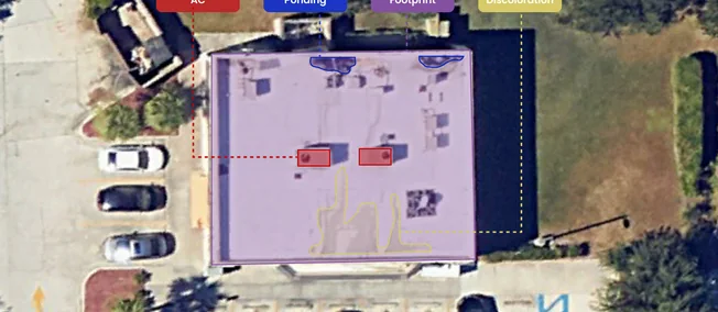 Aerial view of a flat commercial roof with rooftop units tagged