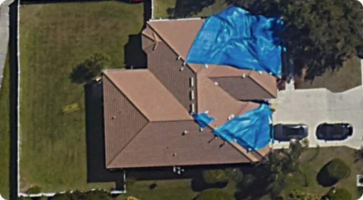 Aerial view of a roof rated Damaged